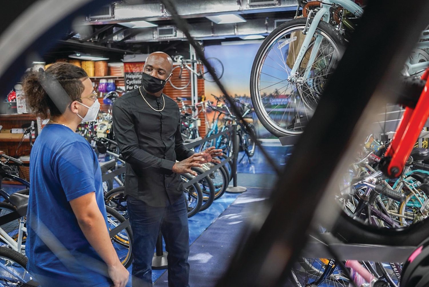 Santonio Holmes discusses bikes at the Palm Beach Bicycle Trail Shop.